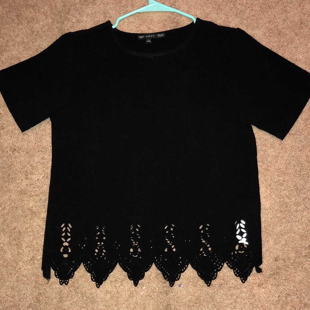 Black shirt with lace pattern at the bottom